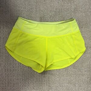 Used neon yellow lululemon shorts LR size 2 with 2.5 length